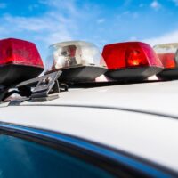 Close-up of cops flashing on old New York police car.