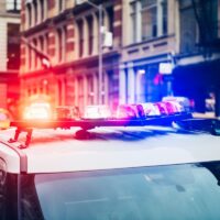 Police car with alarm and signal light flashes on the roof rush emergency call in New York City