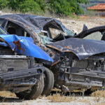 cars parked on side after multiple car crash