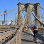 Bikers riding across brooklyn bridge