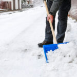 Guy shoveling snow