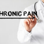 Doctor writing word Chronic Pain with marker